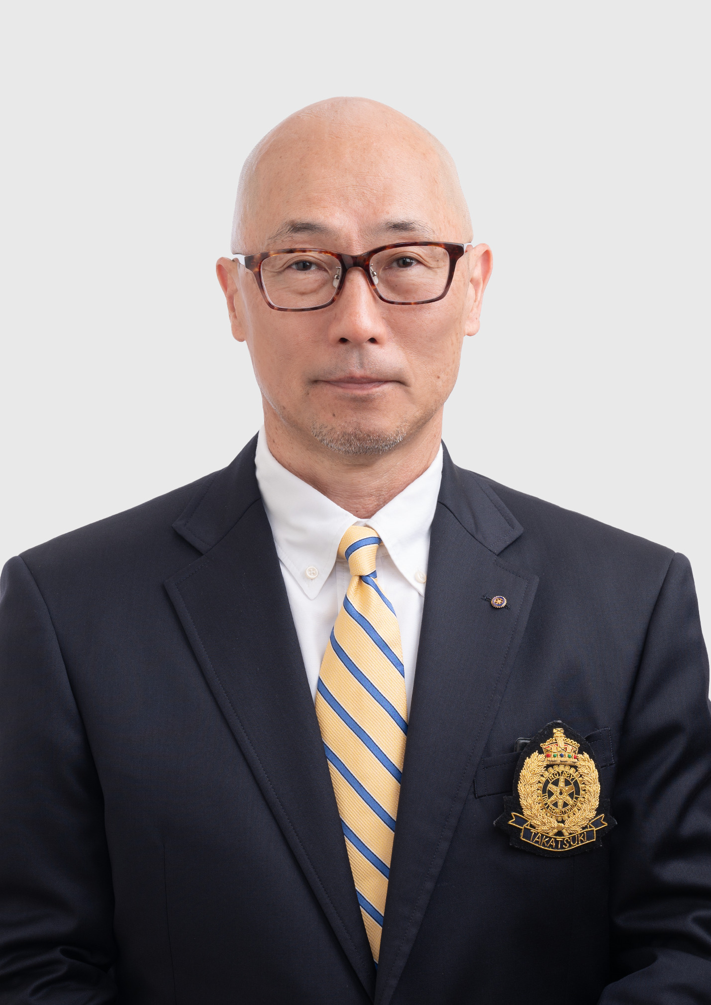 幹事 飯田 哲久